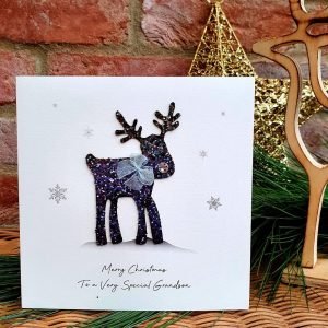 A luxury Christmas card from Five Dollar Shake with a glittery cute reindeer. Merry Christmas to a very special Grandson
