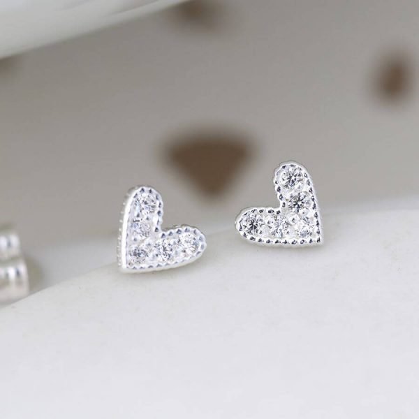 A pair of silver crystal heart earrings. Heart shape stud earrings with cubic zirconia crystals.