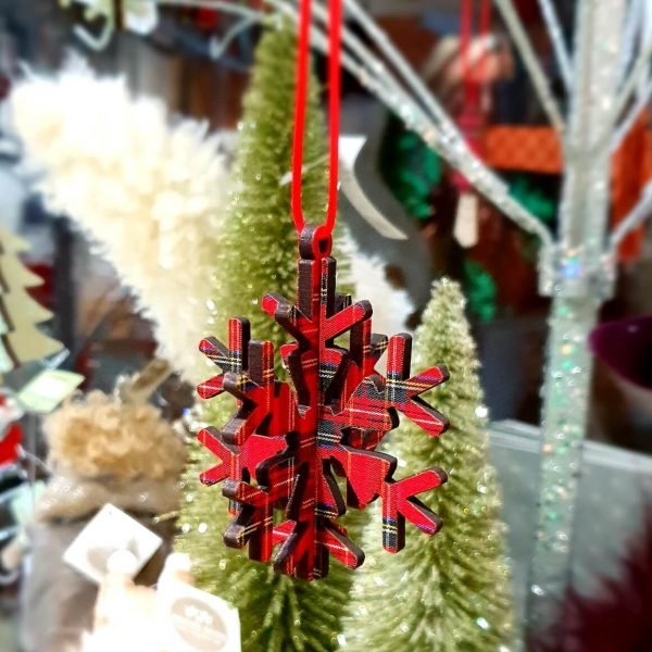 A 3D wooden snowflake hanging tree decoration in red tartan.