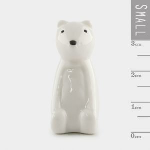 A sweet little porcelain bear keepsake kept in a little cardboard matchbox with the wording 'SOmetimes all you needs is a big bear hug' printed on it.