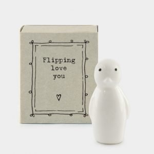 A sweet little porcelain penguin keepsake kept in a little cardboard matchbox with the wording 'Flippin Love You' printed on it.
