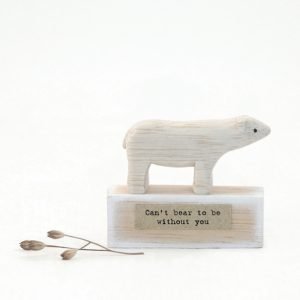 A sweet little wooden bear on a square platform with the words 'Can't bear to be without you' printed on it.