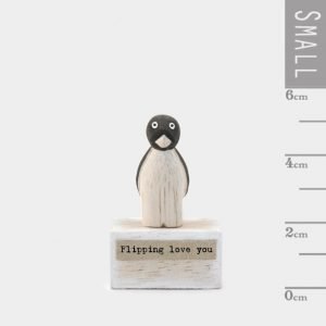 A cute little wooden penguin keepsake from East of India, on a small wooden block with the words 'Flippin Love You' printed on it.