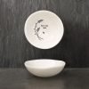 A white ceramic trinket dish from design company East of India. With an image of a flower image and the words Special Mum imprinted on it.