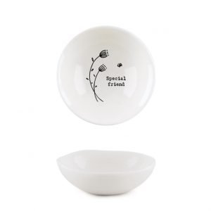 A white mini trinket dish with a flower design and the words 'special friend' imprinted on it.