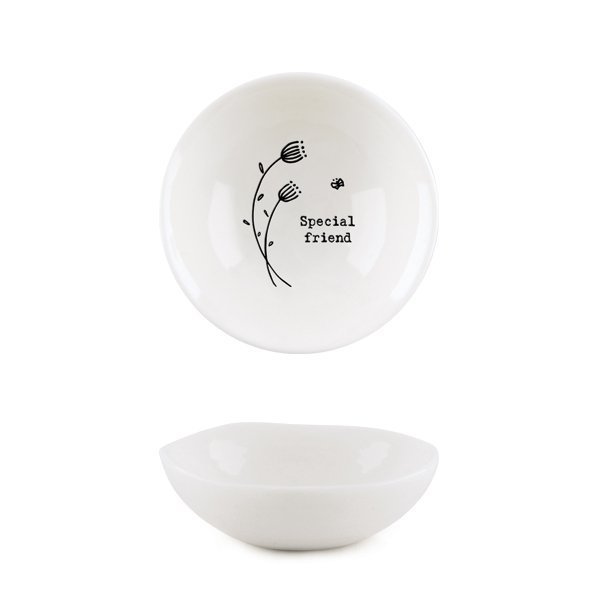 A white mini trinket dish with a flower design and the words 'special friend' imprinted on it.