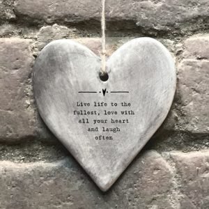A rustic Live Life to the fullest heart which has a grey effect and the words ' Live life to the fullest, love with all your heart and laugh often.