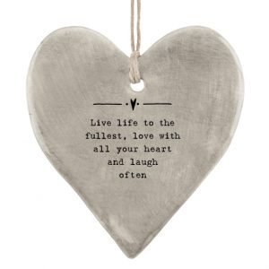 A rustic grey hanging heart with the words ' Live life to the fullest, love with all your heart and laugh often.
