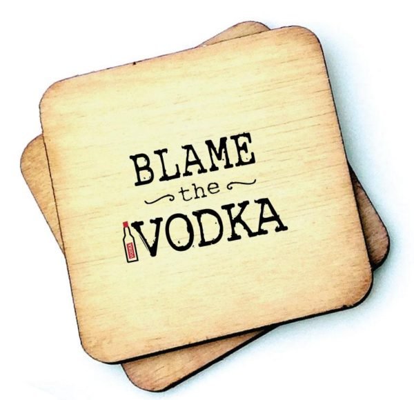 A wooden rustic coaster from Wotmalike with the wording 'Blame the Vodka' printed on it.