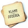 A wooden rustic coaster from Wotmalike with the wording 'Blame the Vodka' printed on it.