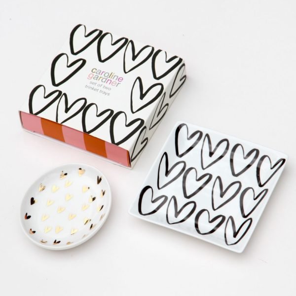 A pair of bone china trinket trays with a heart theme from British designer Caroline Gardner. A perfect birthday or Valentine's day gift.