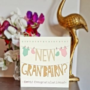 A cute Geordie card to give to someone to celebrate the birth of a new Grandchild. A cream card with a washing line design and the words - Congratulations on your New Gran Bairn printed on it.