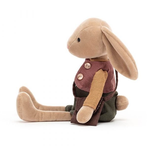 A beige bunny soft toy wearing a mustard jumper, deep rose waistcoat and holly-green bloomers and a satchel.
