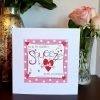 A valentines day card with the words You're My Favourite Squeeze Happy Valentines hand finished with little silver stars and hand stitching.