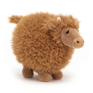 A cute fluffy cow cuddly toy suitable from birth
