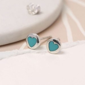 A pair of small sterling silver turquoise heart earrings.