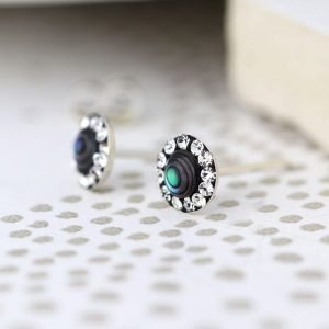 A pair of sterling silver abalone and crystal studs. These earrings have a centre made from abalone shell and are finished with tiny crystals around the edges.