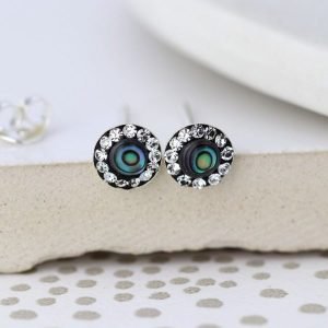 A pair of sterling silver abalone and crystal studs. These earrings have a centre made from abalone shell and are finished with tiny crystals around the edges.