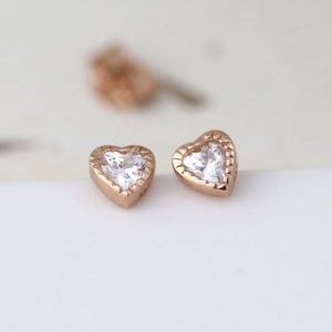 A lovely pair of sterling silver rose gold plated heart earrings with a crystal centre.