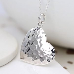 A beautiful hammered heart pendant on a silver chain