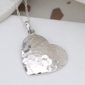 A beautiful hammered heart pendant on a silver chain