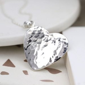 A beautiful hammered heart pendant on a silver chain