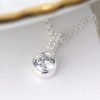 Silver Crystal Drop Necklace. A silver drop pendant with a crystal inset and crystal stem, on a silver chain.