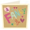 A card from North East design company Wotmalike. The card has a brown paper style with cut out letter look with the words 'A Fancy Ye' on it.