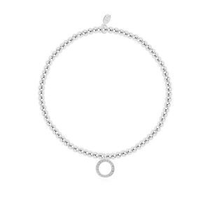 A lovely silver plated stretch bracelet with a gorgeous circle embellished charm on it. The bracelet comes on a card with a colourful confetti design and the words A Little Congratulations printed on it. From Joma Jewellery's A Little range.