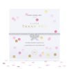 A silver plated elasticated bracelet with an embellished bow charm on it. The bracelet is on a lovely sentiment card with a confetti design all over it. The words A Little Thank You are printed on the card. From Joma Jewellery