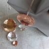 A hand made pendant necklace with 3 hammered discs in decreasing sizes in brass, copper and silver.