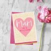 A cream coloured card with a bright pink heart and the words Mum in a Million printed embossed and with lovely foil effect.