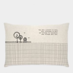 A natural linen long cushion with a feather filled inner. Printed with a modern black and white design of a house and trees and the words May your troubles be less, your blessings be more and nothing but happiness come through your door.