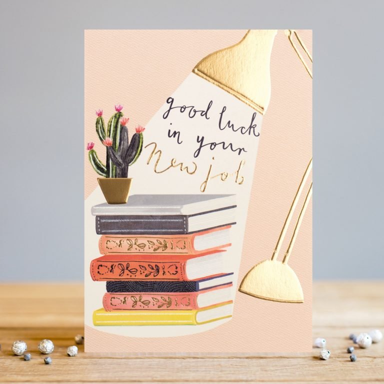 A lovely new job card from card designer Louise Tiler. The image on the card is of a pile of books with a cactus on top of them. A desk lamp is shining on the pile of books and in the beams of the light are the words Good Luck in your New Job.