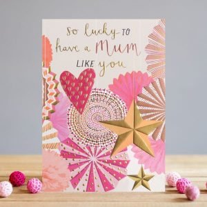 A card with a lilac coloured background and images of colourful fans, hearts and stars. The words So lucky to have a mum like you printed on it.