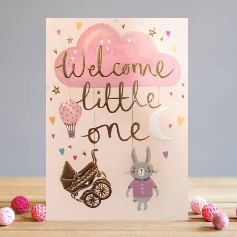 A New Baby Girl Card from Louise Tiler. A pink background with a big pink cloud with images of a pram, hot air balloon a rabbit and a moon on it and the words 'Welcome Little One' embossed, foiled and printed on it.