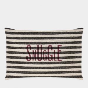 a long cushion with the word Snuggle printed in burgundy over navy and white heavy cotton ticking fabric
