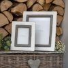 A white wooden frame with a grey trim which is suitable for a 6 x4 photograph.