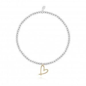 A silver plated elasticated bracelet with round beads and a gold heart pendant. From Joma Jewellery A little range. Presented on a pink card with gold hears and a sentiment that reads this little bracelet is just to say you're a beautiful friend in every way