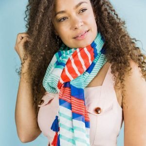 100% cotton scarf in white with multiple stripes and tassels in navy, aqua and red