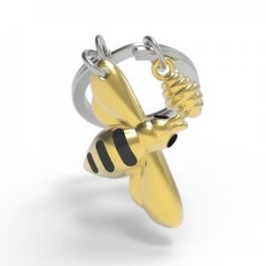 A metal bee key ring in gold and black
