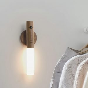 A smart frosted glass light on an adhesive wooden base that can be attached to any wall. The light detaches from the base to be used as a torch. Rechargeable and motion sensitive
