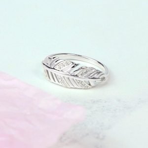 A sterling silver feather ring with cubic zirconia stones to add a bit of sparkle