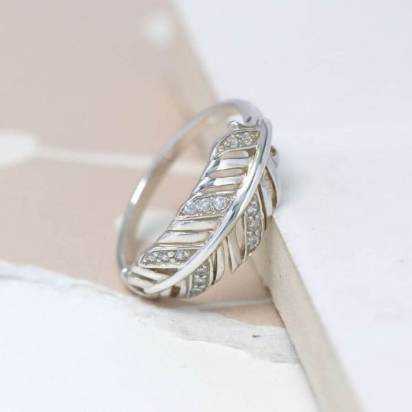 A sterling silver feather ring with cubic zirconia stones to add a bit of sparkle