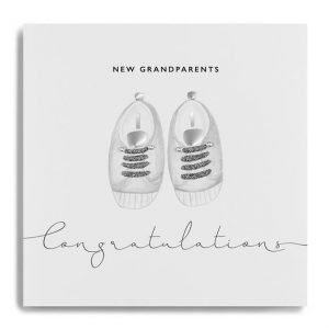 A white square card with an image of a pair of childrens shoes that are finished with little diamante. The words New Grandparents Congratulations are printed on the card