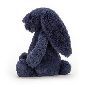 A navy blue fluffy bunny with floppy ears and little pink nose.