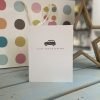 A white card with a little embossed taxi and the words sorry you're leaving underneath