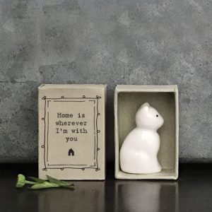 A sweet little ceramic cat in a little matchbox and the words Home is wherever I'm with you printed on it.