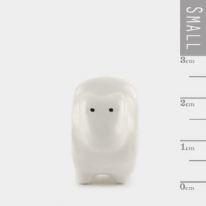 A cute little sheep ceramic keepsake in a matchbox with the words Love you to the moon and back printed on it