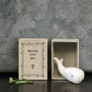 A cute little ceramic whale keepsake in a matchbox with the words Whaley Love you printed on it